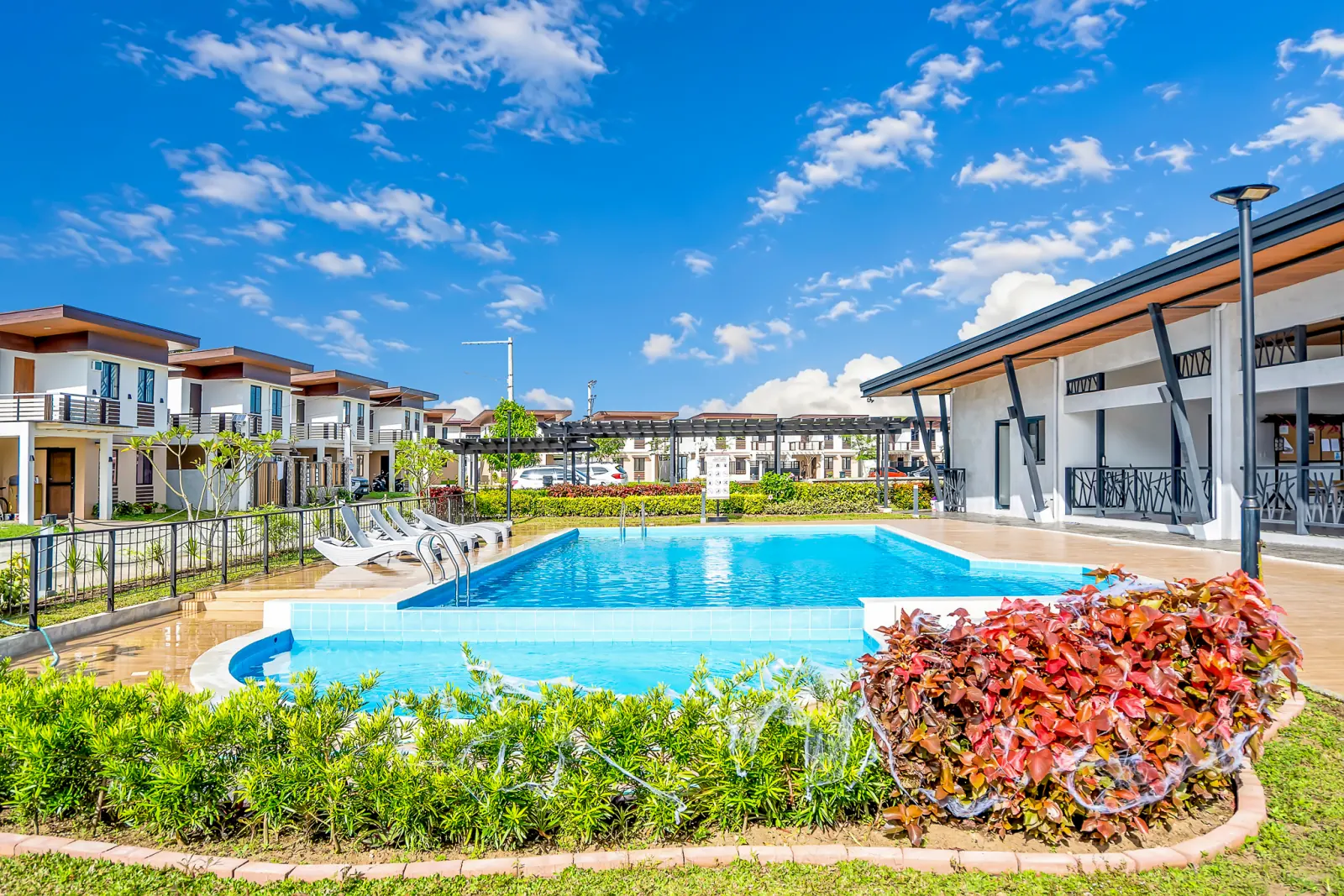 Idesia Lipa community pool under a blue sky