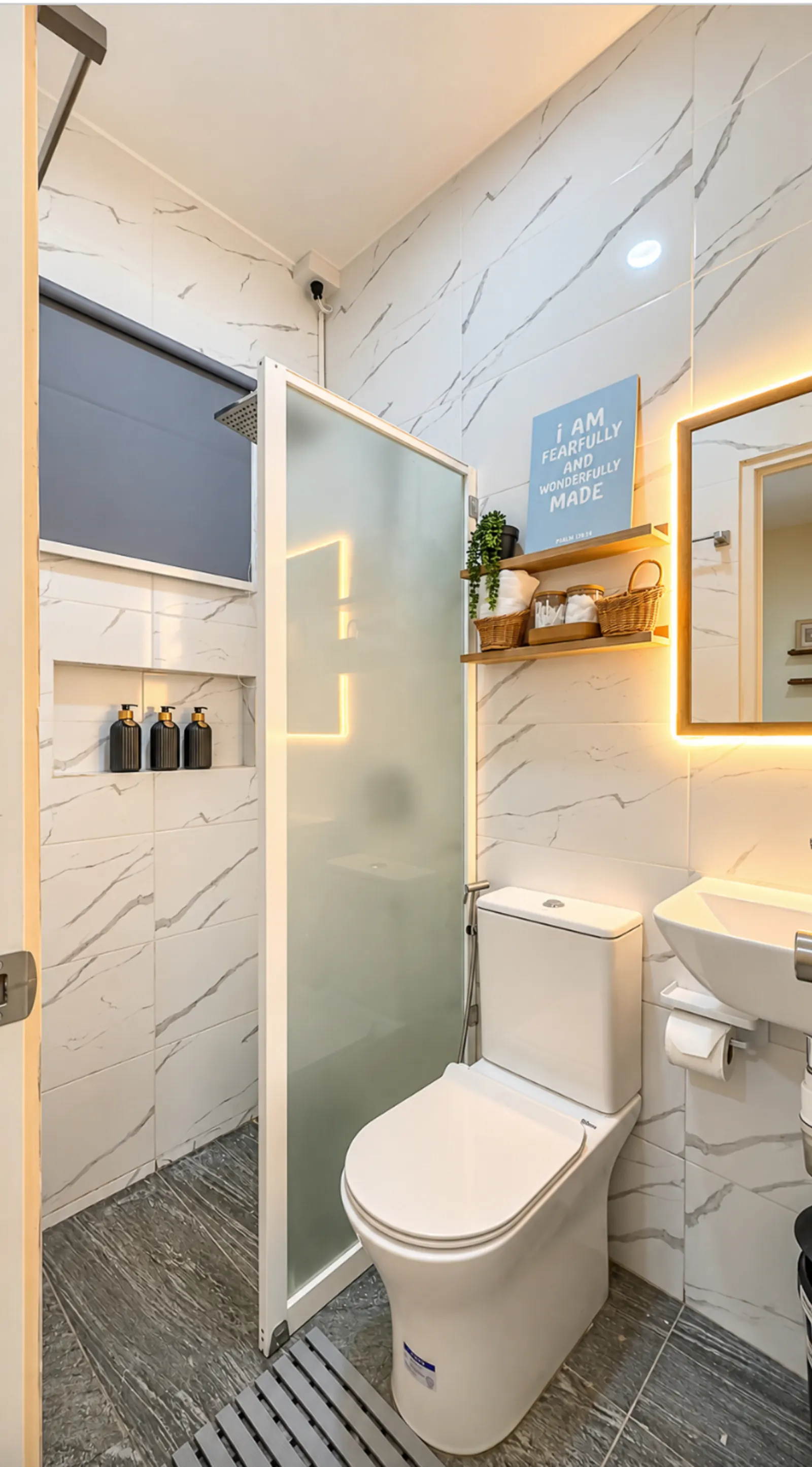 Bathroom with marble-look tiles and glass shower