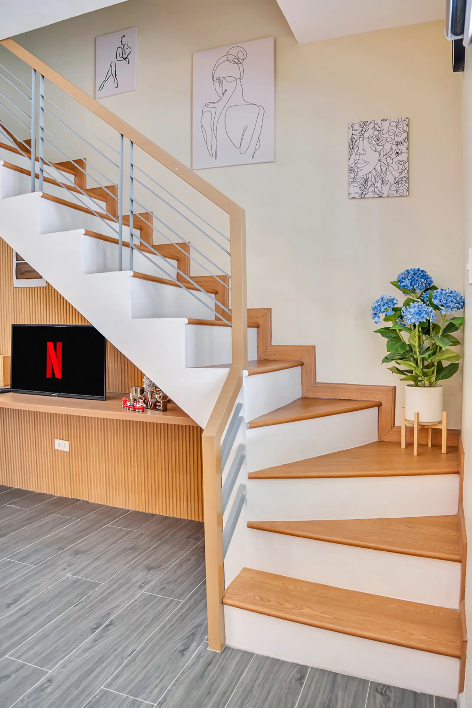 Staircase with TV console below