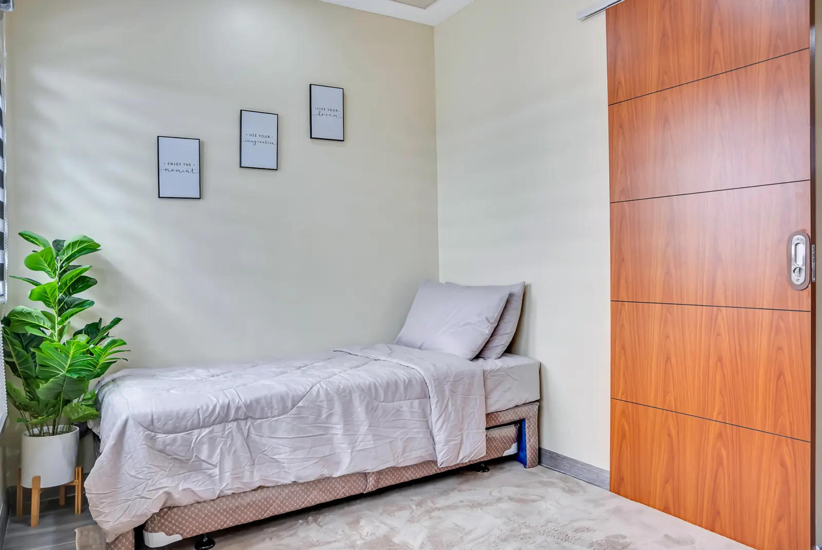 Bedroom 2 with single bed and potted plant